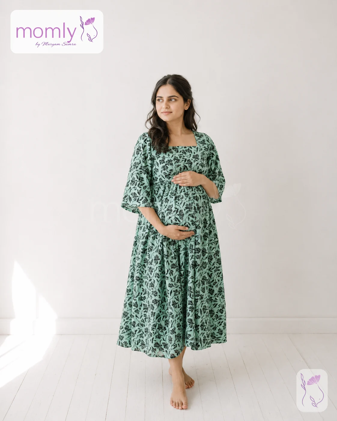 Front view of the sea green floral pregnancy dress
